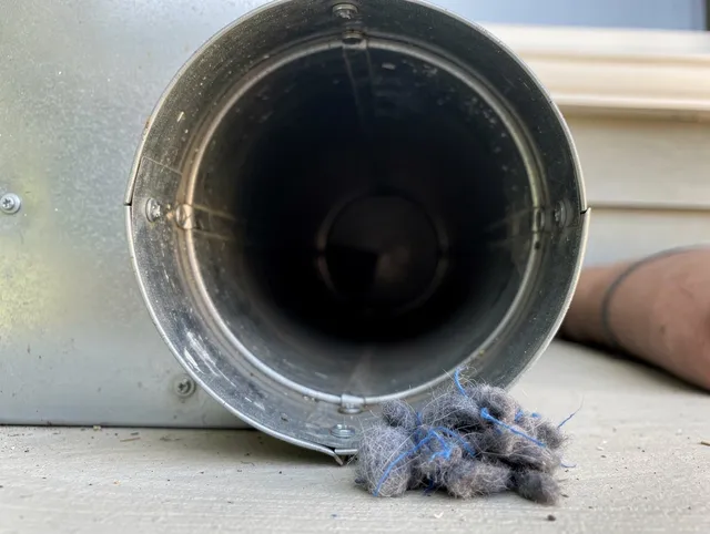 Delray Beach Dryer Vent Cleaning technician using specialized equipment to clear severe dryer vent blockage in Delray Beach